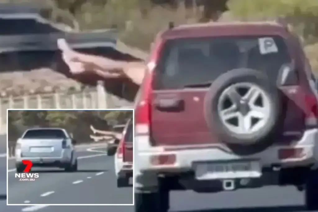 Bizarre video: passagier steekt benen uit autoraam op snelweg bij Adelaide